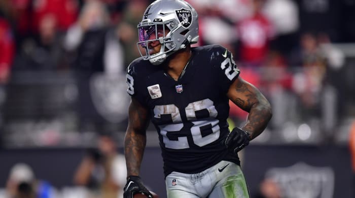 January 1, 2023; Paradise, Nevada, USA; Las Vegas Raiders running back Josh Jacobs (28) scores a touchdown against the San Francisco 49ers during the second half at Allegiant Stadium. Mandatory Credit: Gary A. Vasquez-USA TODAY Sports